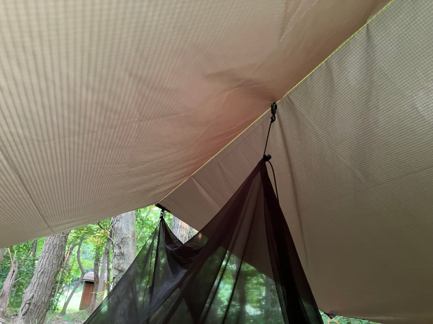 YAMA Mountain Gear Bug Canopy clipped to the ridgeline of a tarp